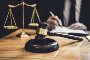 male lawyer writing papers about the law