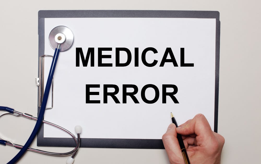 Chicago attorney discussing failure to diagnose cases with a client in an office setting.