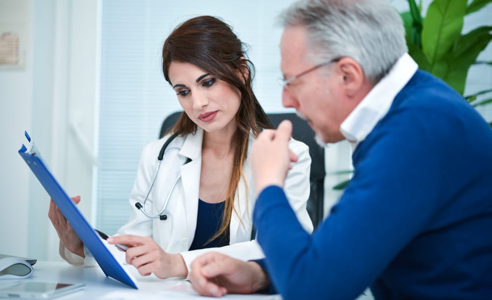 A lawyer reviewing medical bills and negotiating with a healthcare provider.