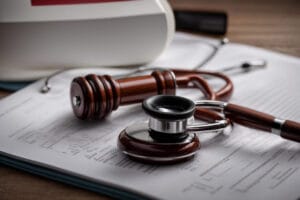 Person looking worried while holding medical documents related to misdiagnosis.