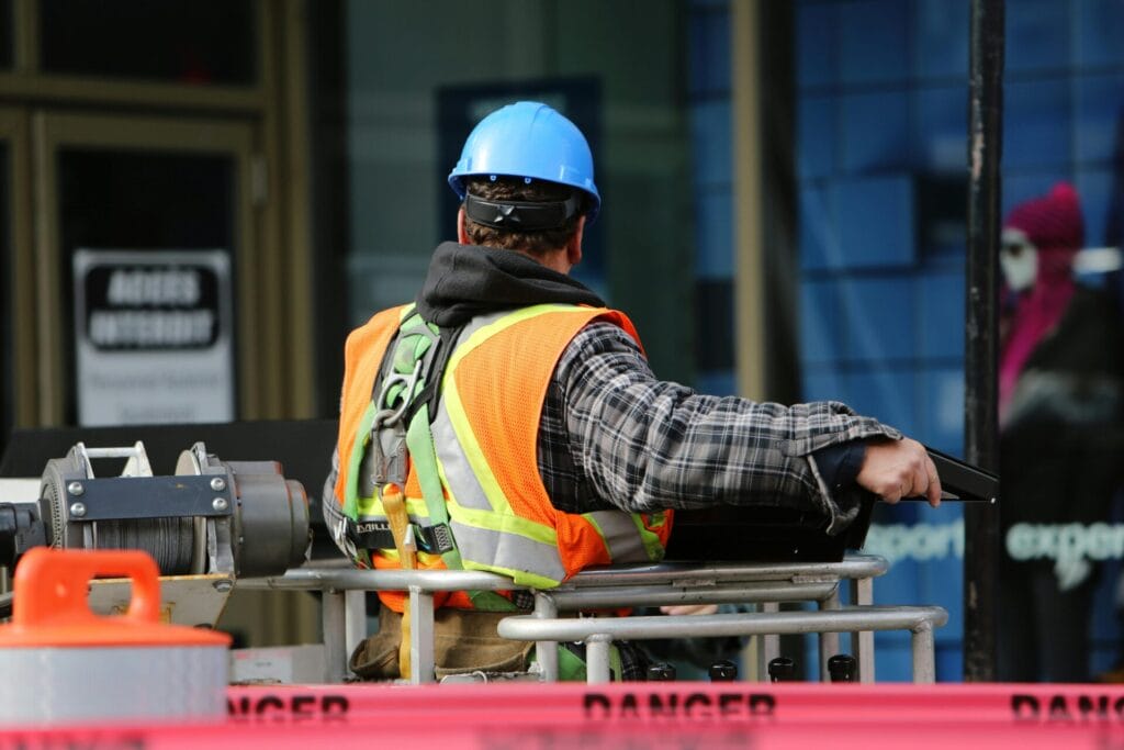 Construction worker wearing safety helmet at an Illinois job site - OSHA safety regulations