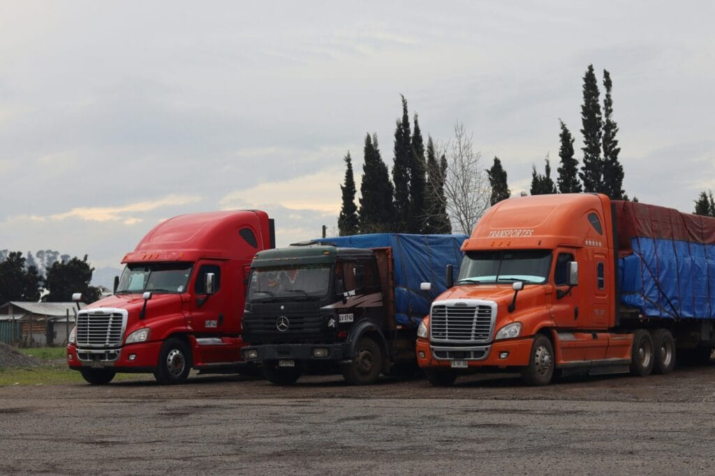 Fleet of trucks parked at a trucking company yard - shell companies and liability investigation