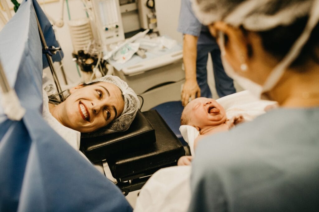 Mother with newborn baby in a hospital delivery room